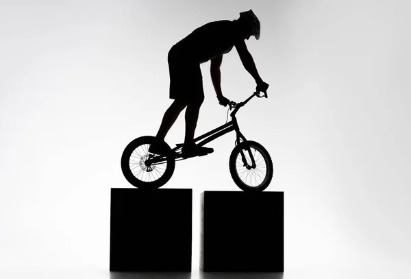 Silhouette Trial Biker Balancing Two Stands White — Stock Photo, Image