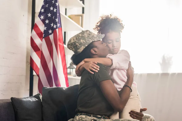 Woman Camouflage Clothes Kissing Her Daughter — Stock Photo, Image