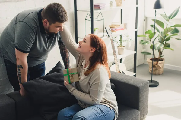 Smiling Girlfriend Hugging Boyfriend Present Home — Stock Photo, Image