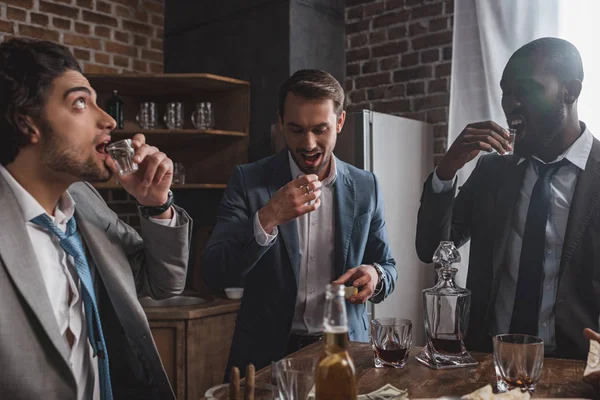 Three Young Multiethnic Friends Suits Drinking Tequila Together — Stock Photo, Image