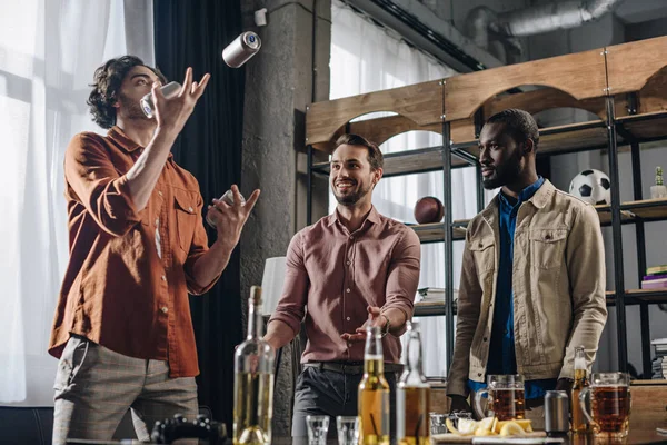Low Angle View Multiethnic Men Looking Friend Juggling Beer Cans — Stock Photo, Image