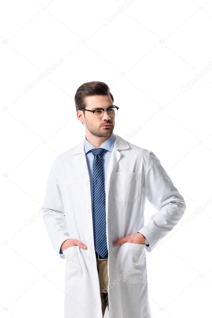 Confident male doctor wearing white coat isolated on white