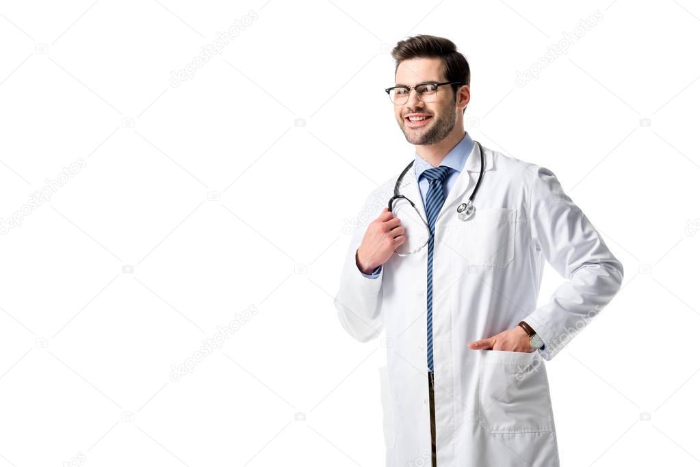 Handsome doctor wearing white coat with stethoscope isolated on white