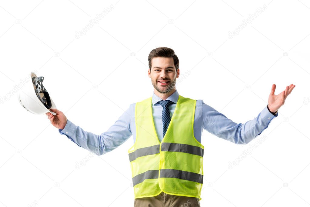 Smiling man in reflective vest holding hardhat isolated on white