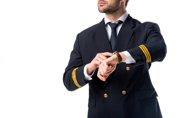 cropped shot of pilot pointing at watch on wrist isolated on white