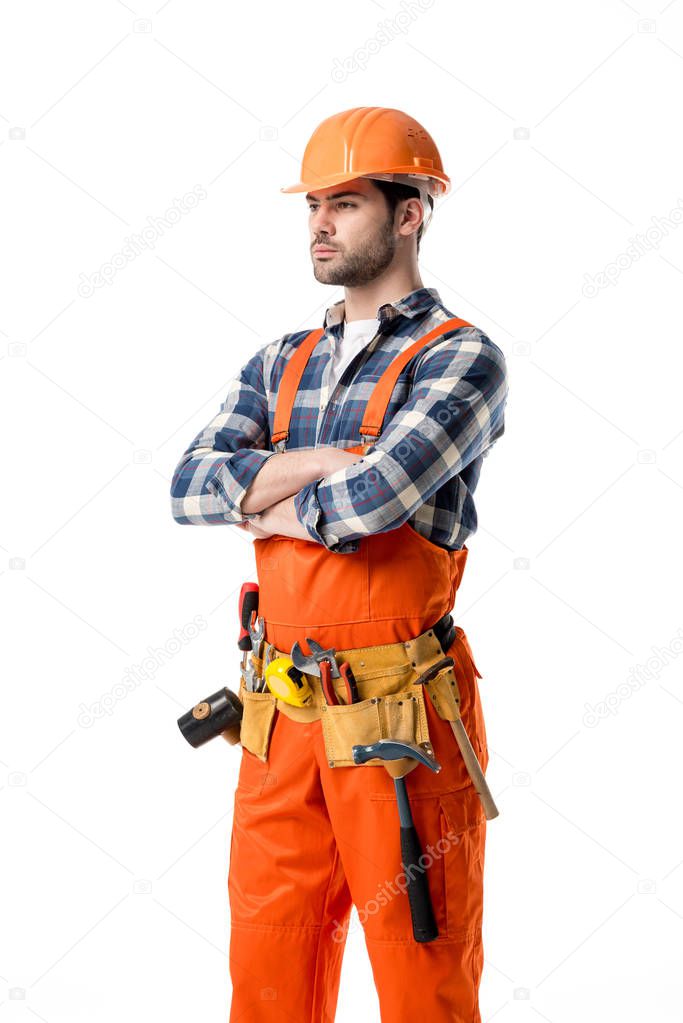 Confident repairman in orange overall and tool belt isolated on white