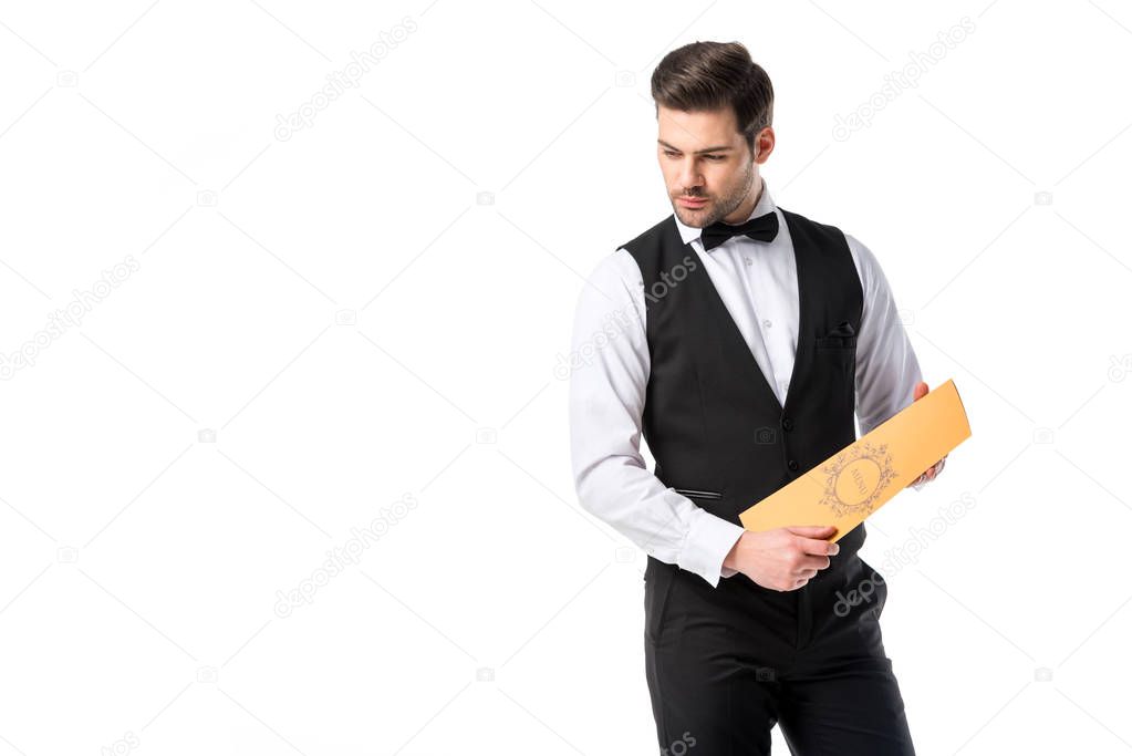 portrait of young waiter in suit vest with menu isolated on white