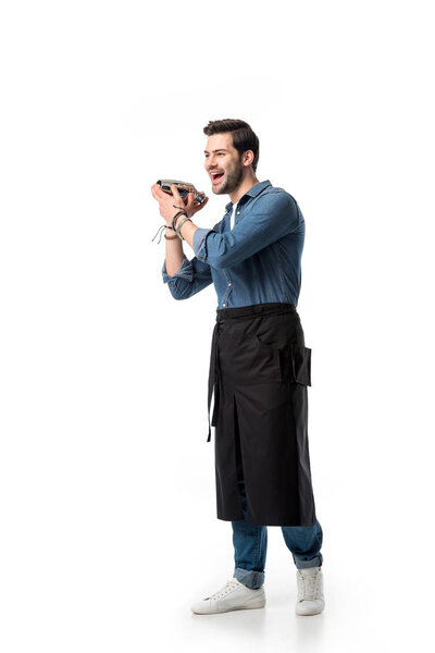 cheerful bartender in apron with shaker in hands isolated on white