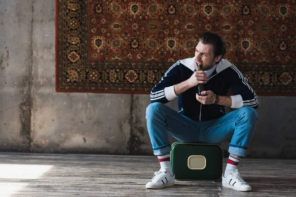 Man Sitting Vintage Little Suitcase Trying Open Beer Teeth Front — Stock Photo, Image