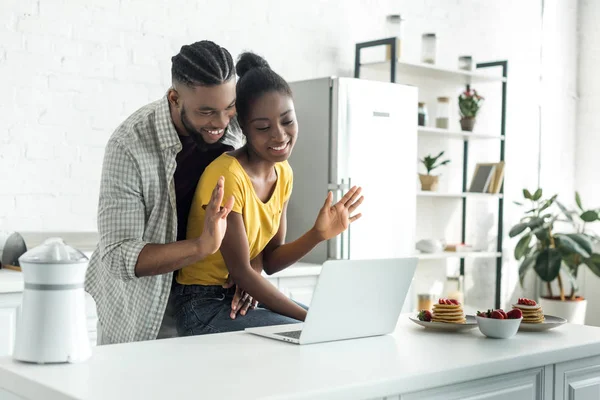 African American Couple Waving Hands Video Call Kitchen — Stock Photo, Image