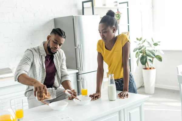 African American Boyfriend Pouring Out Cornflakes Plate Kitchen — Stock Photo, Image