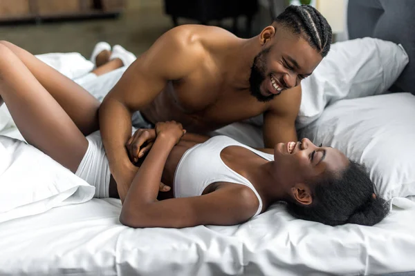 African American Couple Smiling Hugging Bed Bedroom — Stock Photo, Image