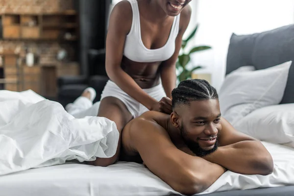 Cropped Image African American Girlfriend Doing Massage Boyfriend Bedroom — Stock Photo, Image