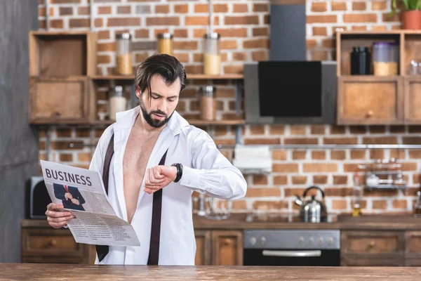 Handsome Loner Businessman Holding Newspaper Checking Time Kitchen — Stock Photo, Image