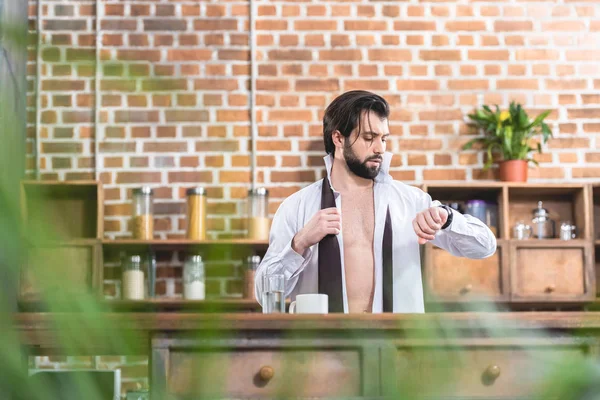 Handsome Loner Businessman Unbuttoned Shirt Checking Time Kitchen — Free Stock Photo