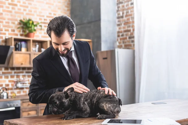 Handsome Loner Businessman Palming Bulldog Kitchen — Free Stock Photo