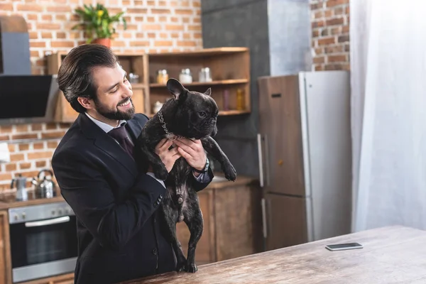 Happy Handsome Loner Businessman Hugging Bulldog Kitchen — Free Stock Photo