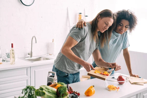 Smiling African American Woman Embracing Boyfriend While Cooking Salad Kitchen — Stock Photo, Image