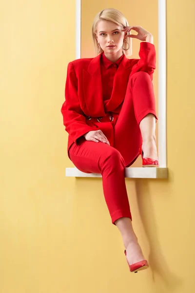 Beautiful Blond Woman Stylish Red Suit Shoes Sitting Decorative Window — Stock Photo, Image