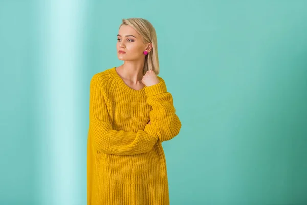Portrait Beautiful Pensive Woman Yellow Sweater Posing Blue Background — Stock Photo, Image
