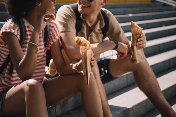 Cropped Shot Young Couple Sitting Stairs Eating Croissants — Stock Photo, Image