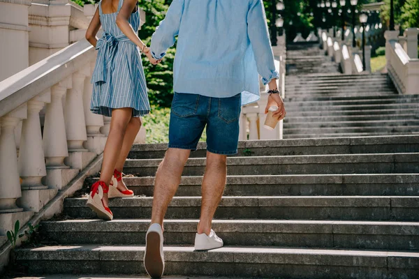 Cropped Shot Stylish Couple Coffee Cup Going Upstairs — Free Stock Photo