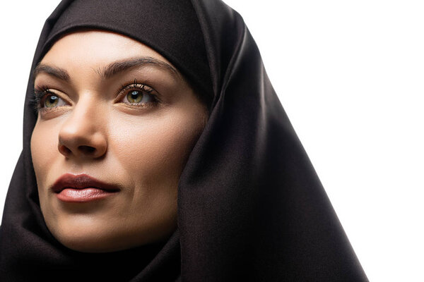 beautiful young Muslim woman in hijab looking away isolated on white