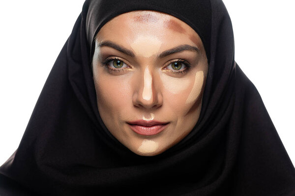 young Muslim woman in hijab with facial contouring isolated on white