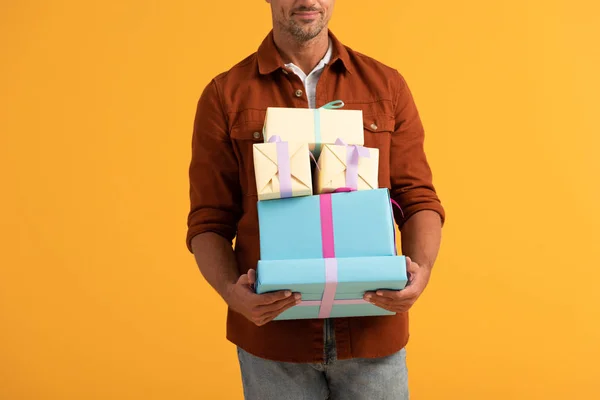 Cropped View Man Smiling While Holding Gift Boxes Isolated Orange — Stock Photo, Image