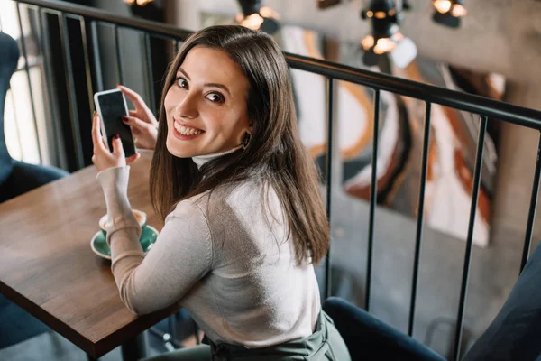Smiling Young Woman Sitting Wooden Table Cappuccino Holding Smartphone Balcony — Stock Photo, Image