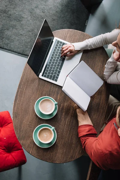 Overhead View Young Couple Working Laptop Holding Blank Notebook Coffee — Stock Photo, Image