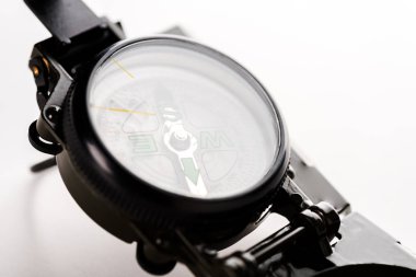 close up of black vintage compass on white  clipart