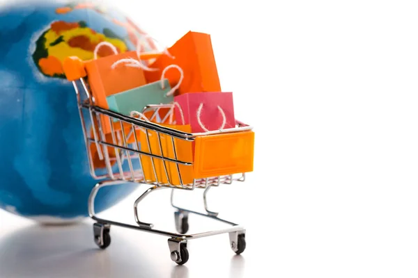 Toy Shopping Cart Small Shopping Bags Globe White Commerce Concept — Stock Photo, Image