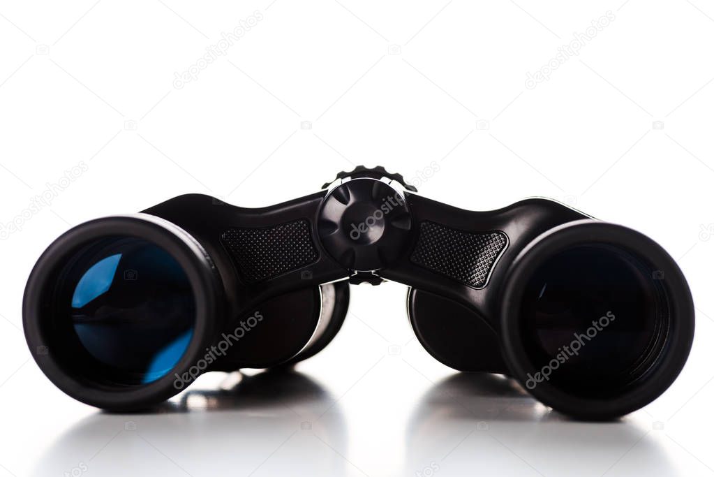 black binoculars with lens on white 