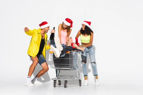 Cheerful Man Sitting Shopping Cart Multicultural Friends White — Stock Photo, Image