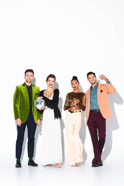 Happy Trendy Multicultural Friends Holding Champagne Glasses Disco Ball White — Stock Photo, Image