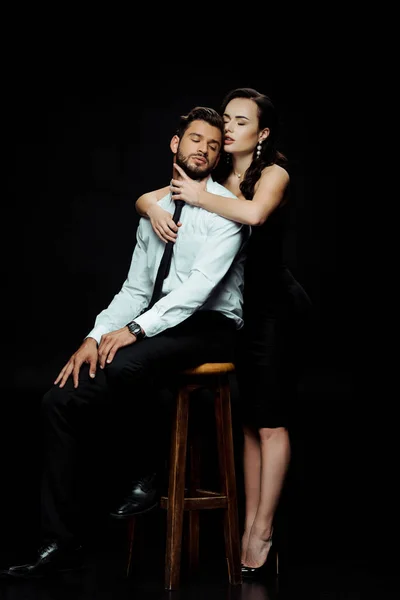 Beautiful Woman Hugging Bearded Man Sitting Chair Isolated Black — Stock Photo, Image