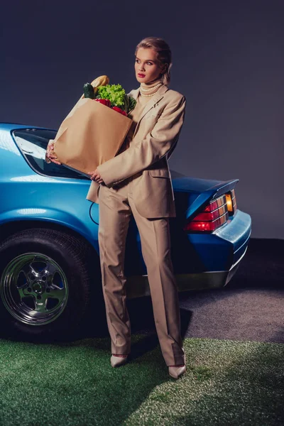Attractive Stylish Woman Suit Standing Retro Car Holding Paper Bag — Stock Photo, Image