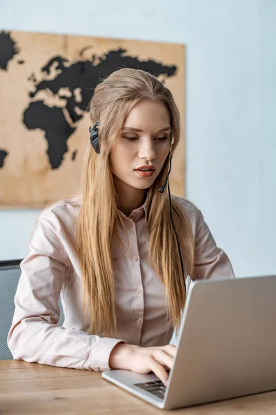 Attentive Travel Agent Headset Looking Laptop — Stock Photo, Image