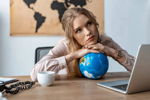 Tired Travel Agent Leaning Globe While Sitting Workplace — Stock Photo, Image
