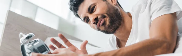 Panoramic Shot Dissatisfied Racial Man Holding Alarm Clock Morning — Stock Photo, Image