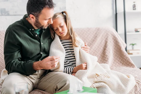 Attentive Father Holding Thermometer Hugging Diseased Daughter — Stock Photo, Image