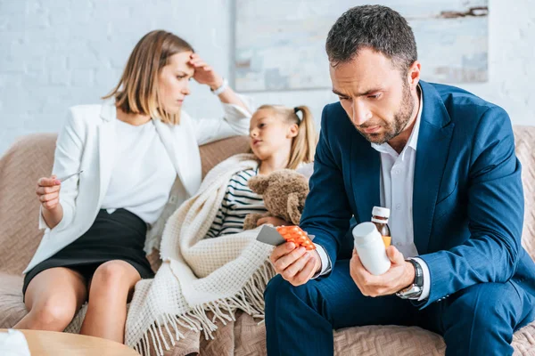 Worried Father Holding Medicines Mother Sitting Diseased Daughter — Stock Photo, Image