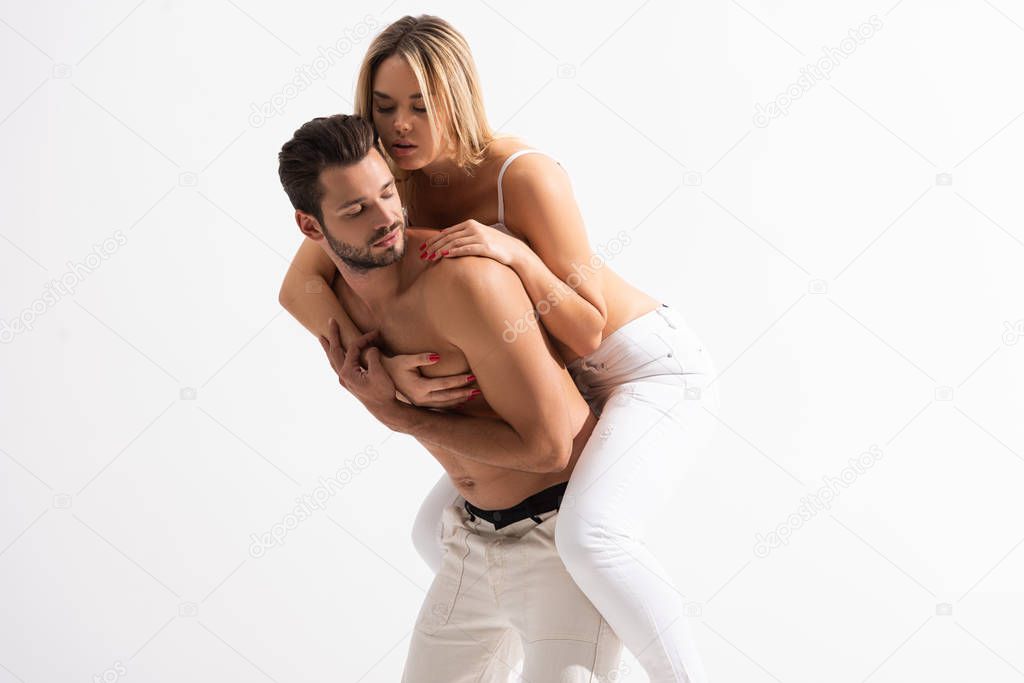 beautiful sexy couple piggybacking, isolated on white