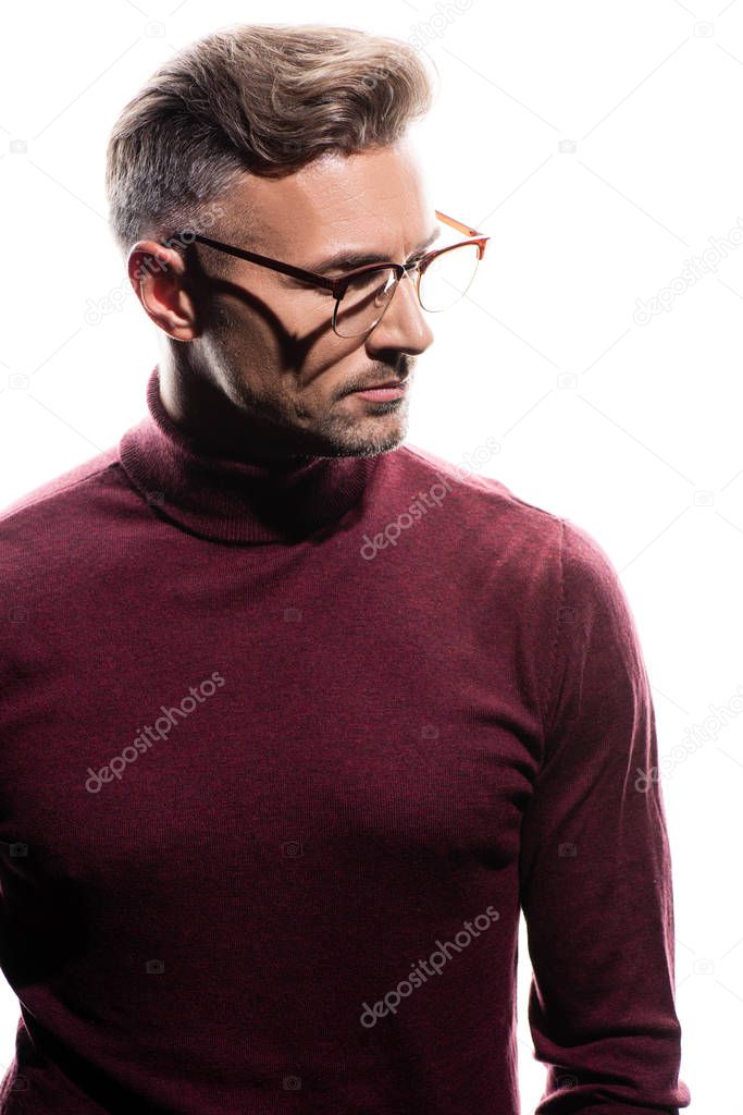 Handsome man in eyeglasses looking away isolated on white