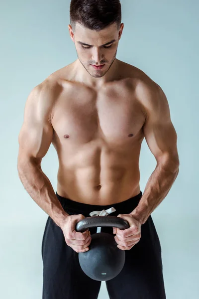 Sexy Muscular Bodybuilder Bare Torso Exercising Kettlebell Isolated Grey — Stock Photo, Image