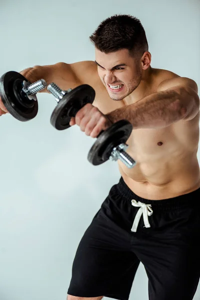 Tense Muscular Bodybuilder Bare Torso Working Out Dumbbells Isolated Grey — Stock Photo, Image