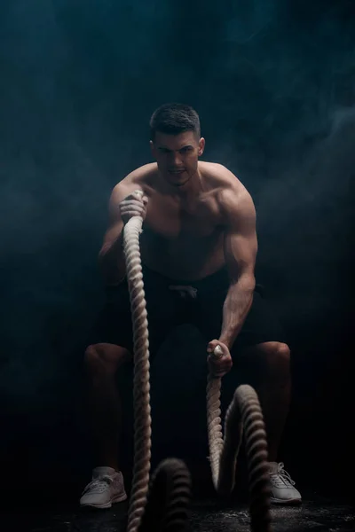 Sexy Muscular Bodybuilder Bare Torso Excising Battle Rope Black Background — Stock Photo, Image