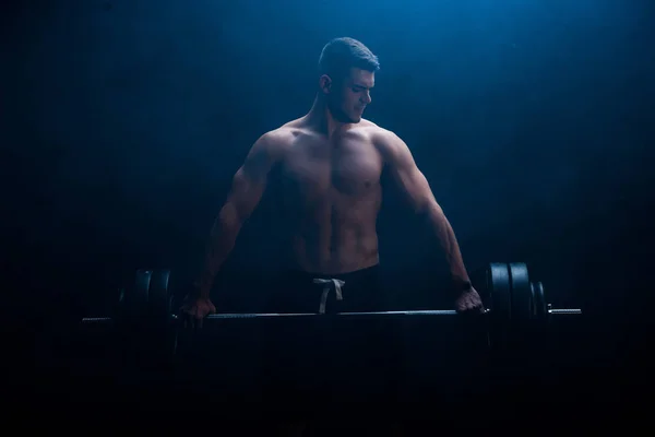 Sexy Muscular Bodybuilder Bare Torso Excising Barbell Black Background Smoke — Stock Photo, Image