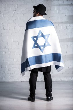 back view of jewish man with flag of israel  clipart